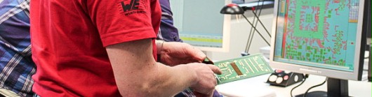 Engineering Employee is checking layout files on a computer